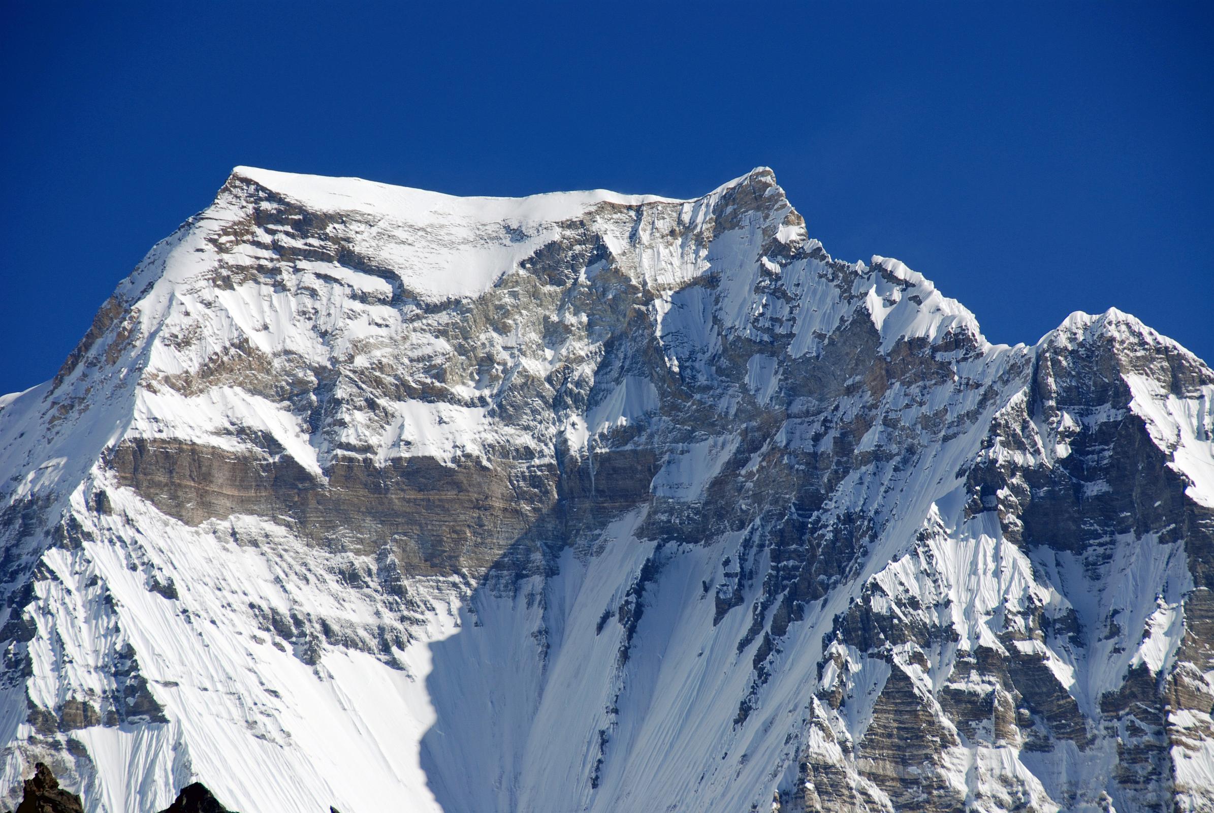 07 Gokyo 5 Scoundrels View 6 Gyachung Kang Close Up Gyachung Kang (7952m) close up from Scoundrels View north of Gokyo. The little known Gyachung Kang (7952m), just 48m short of the magic 8000m mark, is the 15th highest mountain in the world. The mountain was first climbed on April 10, 1964 by Japanese climbers Yukihiko Kato, Kiyoto Sakaizawa and Pasang Phutar Sherpa. The first ascent of the North Face of Gyachung Kang (7952m) was done in pure alpine style with Slovenians Tomaz Jakofcic and Peter Meznar reaching the summit on October 31, 1999, and Andrej Stremfelj, Marko Car, Marko Prezelj, Matic Jost on the next day.